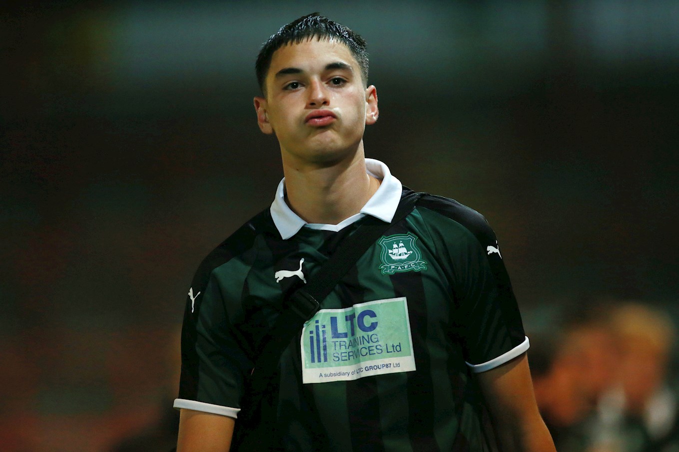 Peterborough Sign Midfielder Lolos from Bolton